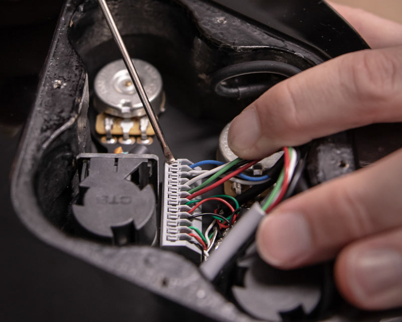 Obsidianwire harness being installed in a Les Paul with colored wires showing